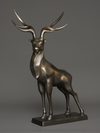 A JAPANESE LARGE BRONZE MUSCULAR STAG, TAISHO PERIOD (1912-1926)