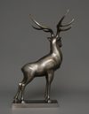 A JAPANESE LARGE BRONZE MUSCULAR STAG, TAISHO PERIOD (1912-1926)