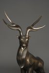 A JAPANESE LARGE BRONZE MUSCULAR STAG, TAISHO PERIOD (1912-1926)