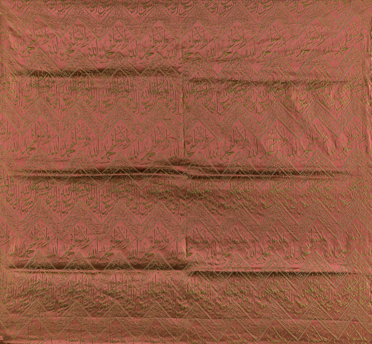 A RED EMBROIDERED SILK KISWA FRAGMENT, 20TH CENTURY