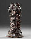 WOODEN OKIMONO OF TWO EMBRACING ELEPHANTS — MASTERFULLY CARVED FROM A SINGLE PIECE OF WOOD,MEIJI PERIOD,1868-1912