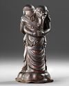WOODEN OKIMONO OF TWO EMBRACING ELEPHANTS — MASTERFULLY CARVED FROM A SINGLE PIECE OF WOOD,MEIJI PERIOD,1868-1912