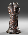 WOODEN OKIMONO OF TWO EMBRACING ELEPHANTS — MASTERFULLY CARVED FROM A SINGLE PIECE OF WOOD,MEIJI PERIOD,1868-1912