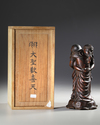 WOODEN OKIMONO OF TWO EMBRACING ELEPHANTS — MASTERFULLY CARVED FROM A SINGLE PIECE OF WOOD,MEIJI PERIOD,1868-1912