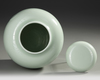 A CHINESE CELADON-GLAZED JAR AND COVER