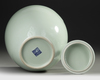 A CHINESE CELADON-GLAZED JAR AND COVER
