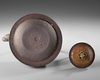 A JAPANESE CAST IRON TETSUBIN – CRANE AND WAVES DESIGN WITH BRONZE LID,EDO PERIOD (1615–1868)