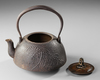 A JAPANESE CAST IRON TETSUBIN – CRANE AND WAVES DESIGN WITH BRONZE LID,EDO PERIOD (1615–1868)