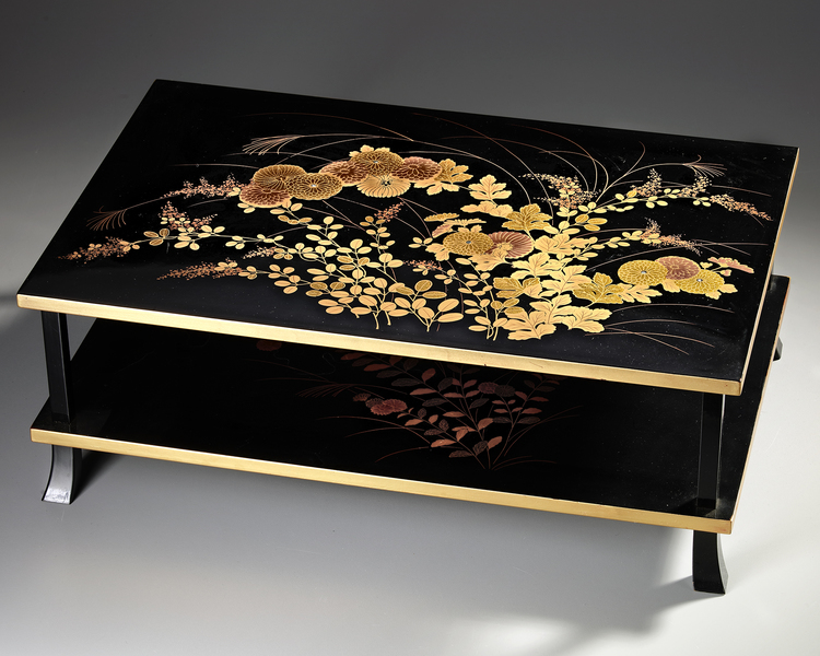 A LOW LACQUERED TWO-LEVEL JAPANESE TABLE WITH FLORAL DESIGNS, SHOWA PERIOD