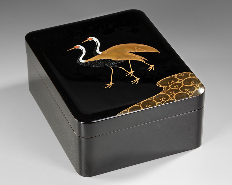 A JAPANESE BLACK LACQUER BOX WITH CRANES — GOLD MAKI-E, RADEN INLAY & SIGNED WOODEN CASE,MEIJI PERIOD,1868-1912