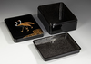 A JAPANESE BLACK LACQUER BOX WITH CRANES — GOLD MAKI-E, RADEN INLAY & SIGNED WOODEN CASE,MEIJI PERIOD,1868-1912