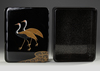 A JAPANESE BLACK LACQUER BOX WITH CRANES — GOLD MAKI-E, RADEN INLAY & SIGNED WOODEN CASE,MEIJI PERIOD,1868-1912