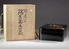 A JAPANESE BLACK LACQUER BOX WITH CRANES — GOLD MAKI-E, RADEN INLAY & SIGNED WOODEN CASE,MEIJI PERIOD,1868-1912