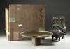 A JAPANESE HEAVY BRONZE USEBATA, ACOW-SHAPED BASE WITH BASKET AND ORIGINAL MARKED WOODEN BOX,MEIJI PERIOD,1868-1912
