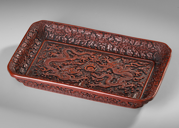 A CHINESE RED LACQUERED TRAY WITH DOUBLE DRAGON AND BUDDHIST FLAME MOTIF, 20TH CENTURY