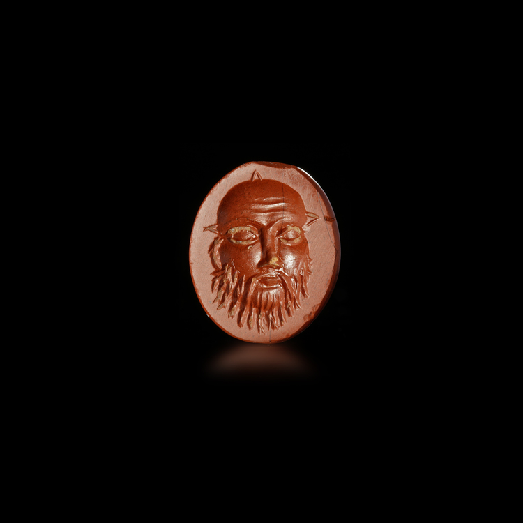 RED JASPER INTAGLIO OF SILENUS’ FACE ROMAN, 1ST–2ND CENTURY A.D.