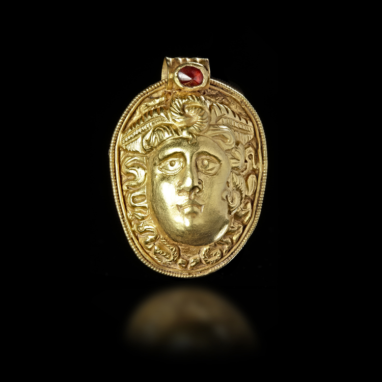 A GOLD PENDANT IN THE SHAPE OF THE HEAD OF MEDUSA, 2ND-3RD CENTURY AD