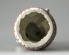 A JAPANESE FIGURE OF A BOY ON DRUM,1670-1690
