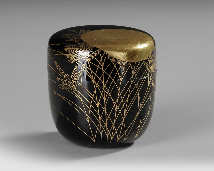 A NATSUME TEACADDY, FINELY LACQUERED WITH A LARGE RISING SUN SHINING THROUGH BRANCHES AND LEAVES, 20TH CENTURY