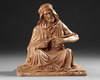 A TERRACOTTA SCULPTURE DEPICTING AN ARAB MAN