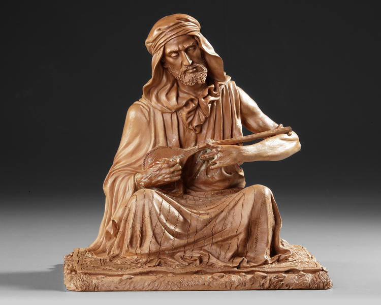 A TERRACOTTA SCULPTURE DEPICTING AN ARAB MAN