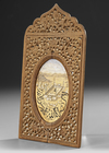 A SMALL PAINTING OF MECCA IN AN ORNATE WOODEN FRAME, DATED 1331 AH/1912 AD