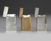 A FRENCH GOLD PLATED TWO SILVER ST. DUPONT LIGHTERS