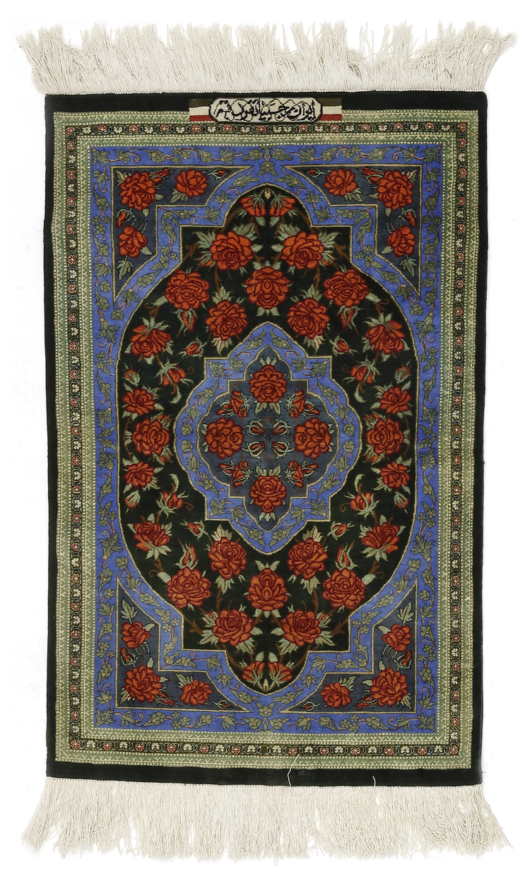 A PERSIAN SILK CARPET, SIGNED