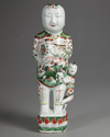A CHINESE  FAMILLE VERTE FIGURE OF A BOY, KANGXI PERIOD (1661-1722)