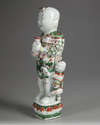 A CHINESE  FAMILLE VERTE FIGURE OF A BOY, KANGXI PERIOD (1661-1722)