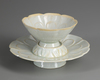 A CHINESE 'QINGBAI' CUP AND STAND, SONG DYNASTY (960-1279 AD)