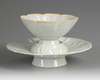 A CHINESE 'QINGBAI' CUP AND STAND, SONG DYNASTY (960-1279 AD)