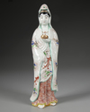 A JAPANESE GREEN ENAMELLED PORCELAIN FIGURE OF A LADY, 19TH CENTURY
