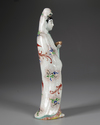 A JAPANESE GREEN ENAMELLED PORCELAIN FIGURE OF A LADY, 19TH CENTURY