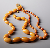 TWO AMBER NECKLACES