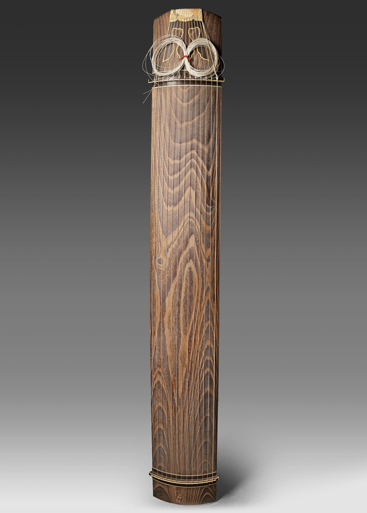 A JAPANESE KOTO ZITHER  TRADITIONAL STRINGED INSTRUMENT