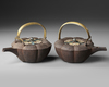 A SET OF TWO IRON SAKÉ KETTLES  JAPANESE, MEIJI TO TAISHŌ PERIOD (LATE 19TH – EARLY 20TH CENTURY)