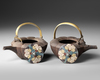 A SET OF TWO IRON SAKÉ KETTLES  JAPANESE, MEIJI TO TAISHŌ PERIOD (LATE 19TH – EARLY 20TH CENTURY)