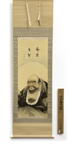 A JAPANESE SCROLL PAINTING OF DARUMA