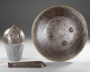 A PERSIAN GILT DAMASCENED HELMET, SHIELD AND ARM-GUARD, QAJAR 19TH CENTURY