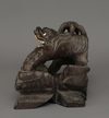 CHINESE WOODEN SCULPTURE DEPICTING A GUARDIAN LION