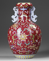 A CHINESE FAMILLE ROSE RUBY GROUND VASE, 19TH/20TH CENTURY
