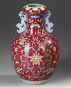 A CHINESE FAMILLE ROSE RUBY GROUND VASE, 19TH/20TH CENTURY