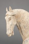 A PAIR OF LARGE CHINESE POTTERY TANG HORSES