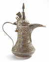 A SILVER COFFEE POT OR DALLAH, OMAN NIZWA, CIRCA 1930-1950