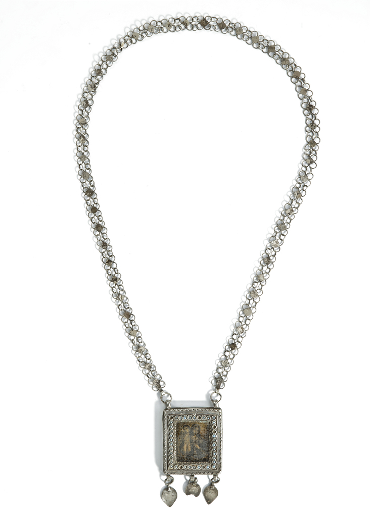 A SILVER NECKLACE DEPICTING MARIA AND CHILD, IRAQ, 19TH CENTURY