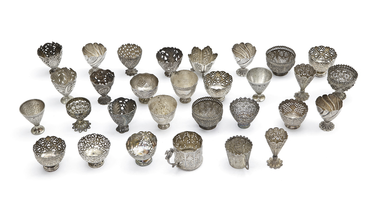 AN OTTOMAN COLLECTION OF THIRTY SILVER CUPHOLDERS, 19TH CENTURY