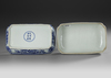 A CHINESE BLUE AND WHITE RECTANGULAR DRAGON BOX AND COVER, QING DYNASTY (1644–1911)