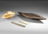 Ancient Asmat bowl, Asmat Sleeping shell and two small saw fish rostrums.