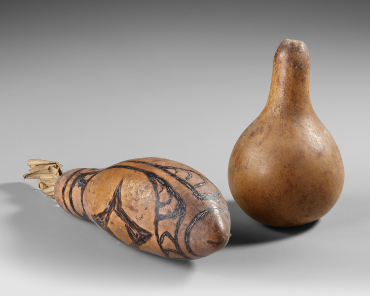 Two Sentani gourd lime containers. Collected by Jac Hoogerbrugge in the 1950’s
